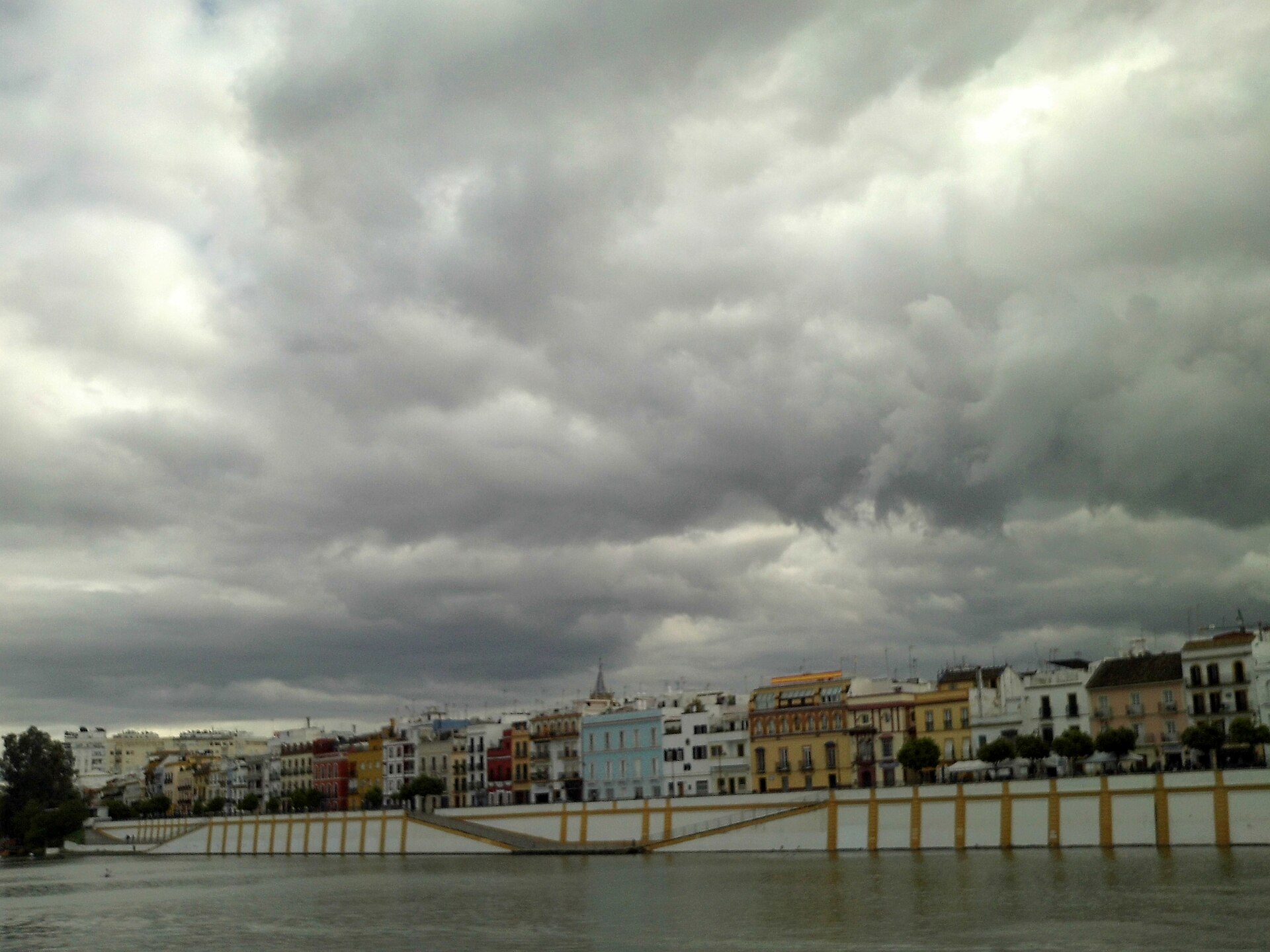 Colorful traditional Andalusian facades on Calle Betis in Triana, Seville — Seville, Spain
